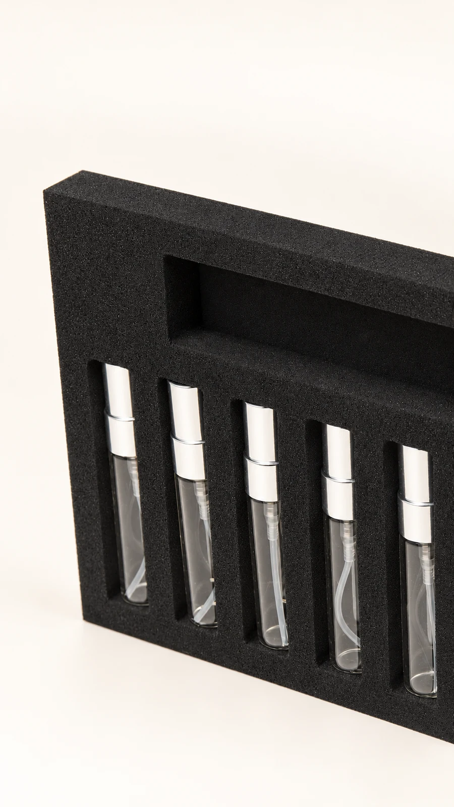 A closer look at fitted compartments following the small bottles’ profiles.