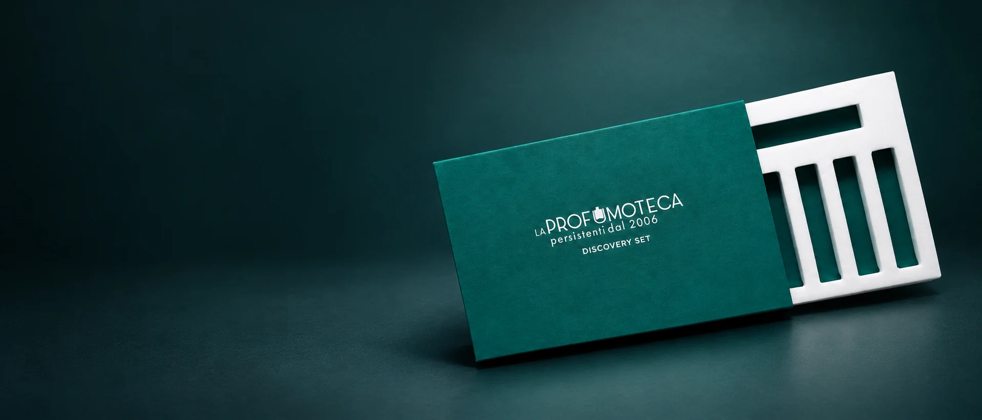 Green La Profumoteca discovery box with a white fitted insert for perfume samples